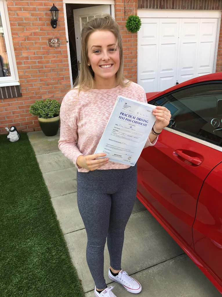 Student celebrating driving test pass in Falkirk